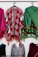 Red and white, green and pink shawls for sale in Guatavita in the arts and crafts plaza. Colombia, South America.