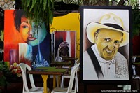 Old Colombian man with hat painting, eat at La Maloca Restaurant and enjoy the artwork in Ricaurte, Girardot. Colombia, South America.
