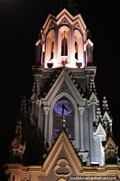 Glowing clock and bell tower of Ermita Church in Cali.