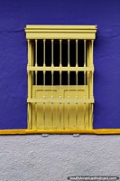 Colombia Photo - Wooden yellow window and a blue wall in the San Antonio Neighborhood in Cali.
