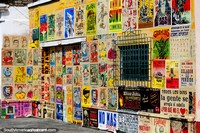 Shopfront covered with colorful posters in the San Antonio Neighborhood in Cali.