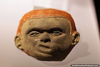 Face of a boy created with pottery, like the boy from the Mad comics, La Merced Archaeological Museum, Cali. Colombia, South America.