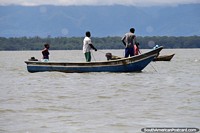 Larger version of Fishermen off the coast of Buenaventura pull in fishing nets.