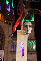 Larger version of Mask-like face of Simon Bolivar, the man-condor above and cathedral behind in Manizales.