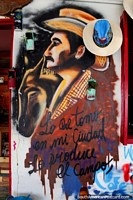 Vaqueiro e o seu cavalo, que pinta em um café em Comuna 13 em Medellïn. Colômbia, América do Sul.