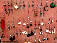 Earrings and jewelry made from shells, seeds, metal and other objects in Taganga. Colombia, South America.