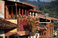 Beautiful flowers in pots make this balcony in Jardin a real eye-catcher. Colombia, South America.