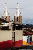 The iconic church in Jardin, 2 silver steeples, view from the streets above. Colombia, South America.