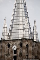 Clock tower with small and large silver steeples, the church in Jardin. Colombia, South America.