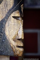 Carved wooden sculpture of an indigenous face in Pereira. Colombia, South America.