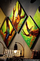 3 paintings of birds in an art shop in Salento, diamond shaped. Colombia, South America.