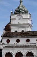 Larger version of San Juan Bautista Temple, first church in Pasto built in 1559 with white clock tower and green dome.
