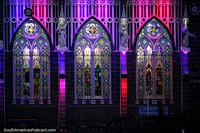 Shades of purple, pink and red, the spectacular light show and arched windows at Las Lajas church. Colombia, South America.