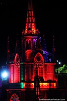 Steeple glowing red, see the amazing Las Lajas church at night in Ipiales. Colombia, South America.