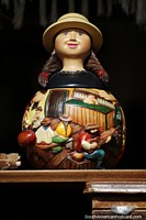 Colombia Photo - An urn featuring a woman and decorated with small figures, an art shop in Paipa.
