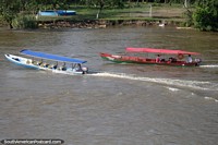 Larger version of 2 passenger boats, a swimming pool and soccer pitch, Magdalena River, Neiva.