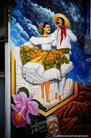 Hombre y mujer en trajes tradicionales bailando, gran mural en Neiva. Colombia, Sudamerica.