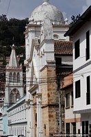 Long street view of historic buildings and churches in Pamplona. Colombia, South America.