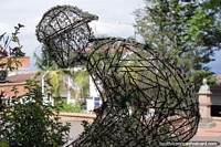 Larger version of Man on a bicycle, sculpture made of steel and plants in Velez.