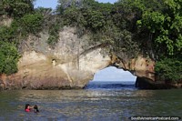 Famous landmark in Tumaco, the Morro arch at high tide. Colombia, South America.