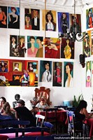 Painted portraits cover the walls of Restaurant El Porton del Parque in Santa Fe de Antioquia. Colombia, South America.