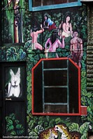 Mural de una escena selvática al costado de una casa en Mocagua cerca de Leticia. Colombia, Sudamerica.