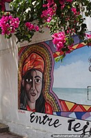 Woman beside the sea, street art by Ainer Lopez, Riohacha.