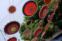Woven and colorful umbrellas above the street in Riohacha.
