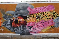 Jaguar with a man and bird, street art in Riohacha.