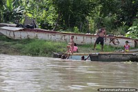Children swim in the river in the hot climate in El Banco.