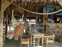 Ecuador Photo - Beach cabana at Puerto Lopez with hammocks, swing seats and tables.