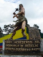 Man with club monument in Tulcan. Ecuador, South America.
