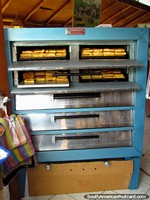Larger version of Bizcochos baking in the oven at Bizcochos Katherine in Cayambe.