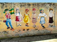 Wall art in Cayambe of the 6 races of local people. Ecuador, South America.