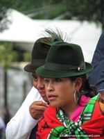 Women of Quito wearing hats with peacock feather. Ecuador, South America.