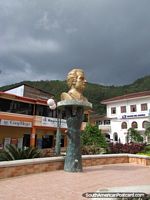Gold monument of man in Zamora. Ecuador, South America.