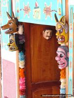 Larger version of A doorway of masks at a shop in Vilcabamba.