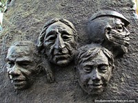 Larger version of 4 faces bronze artwork along the Santa Ana hill staircase in Guayaquil.