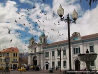 Historical center in Latacunga, San Agustin Church, pigeons flying. Ecuador, South America.