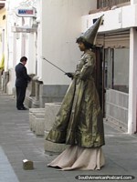 Larger version of Witch and wand, street performer in Latacunga.