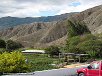 Farm and rocky mountains between Ibarra and Hacienda Carpuela. Ecuador, South America.