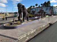 Monument of a mammoth, cavemen and saber toothed tiger around San Gabriel. Ecuador, South America.