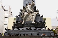 Larger version of White marble figure and 100 pigeons at park Parque Juan Montalvo in Ambato.