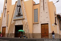 Larger version of Triangular shaped church on a street corner in Ambato.