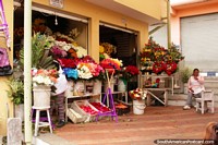 Lots of flowers at this shop at the Ambato flower market. Ecuador, South America.
