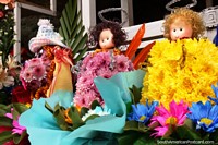 Flower dolls of yellow and purple for sale in Ambato. Ecuador, South America.
