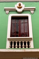 Larger version of Window with gold bust at the top in Guaranda.