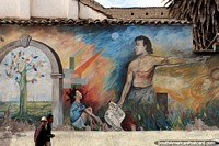 El hombre y un niño, arco y un árbol, mural en Riobamba. Ecuador, Sudamerica.