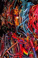 Wrist-bands and stringy things for sale at Plaza Roja in Riobamba. Ecuador, South America.