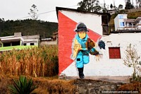 Mural de un niño en un sombrero en una casa en las colinas de Alausí. Ecuador, Sudamerica.